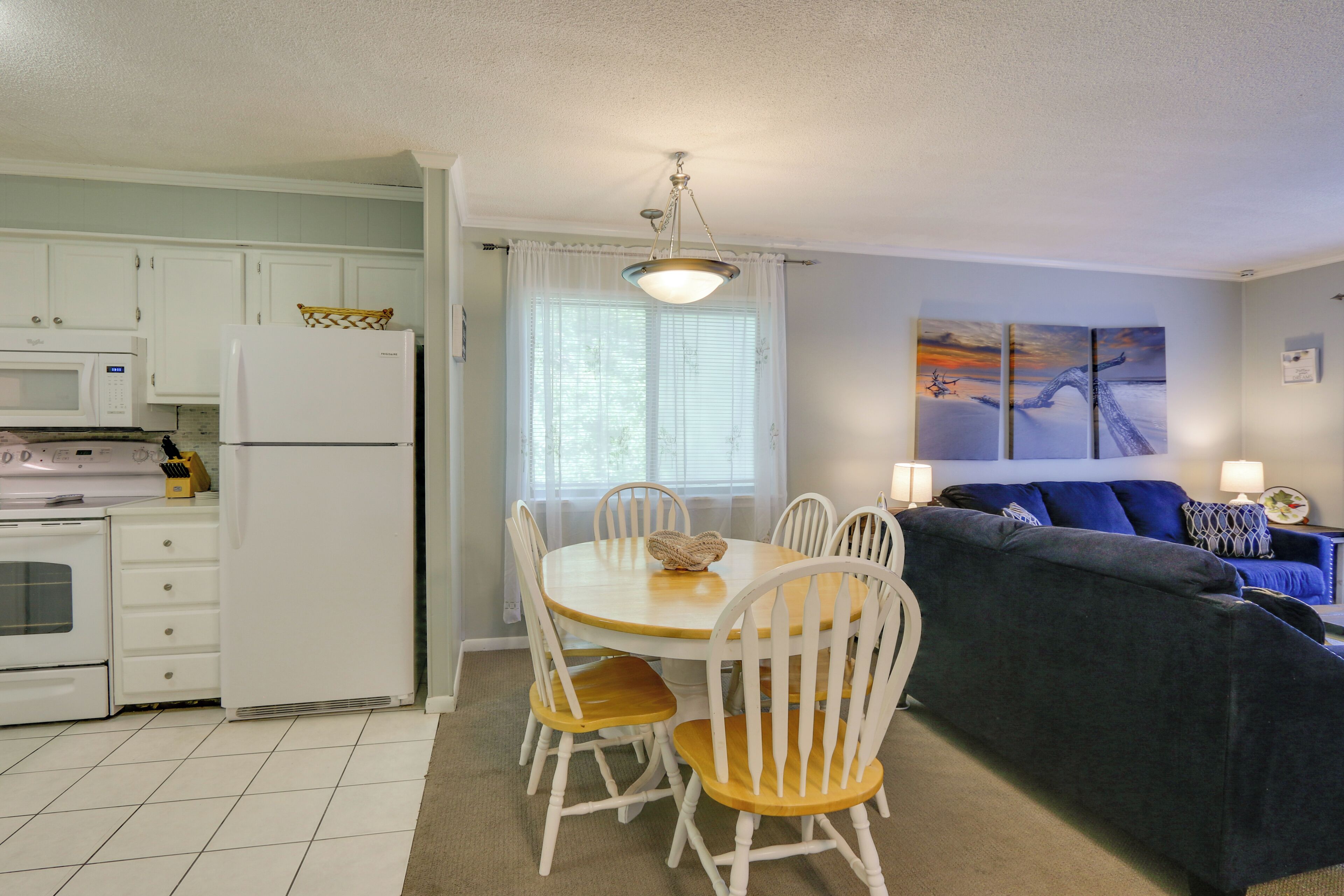 A compact living space with a kitchen, dining area, and seating area.