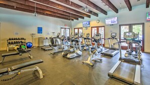 A gym with treadmills, elliptical machines, and free weights. - 243460: 3BR Desert Retreat w/ Views + Pool Access (La Quinta)