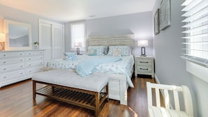 A bedroom with a bed, bedside tables, a bench, and a chair. - Families Welcome! Home 2 Mi to Craigville Beach (Hyannis)