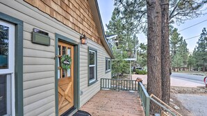 A wooden house with a porch, a welcome sign, and a mailbox. - Walk to Big Bear Lake: Cozy Cabin w/ Deck (Big Bear Lake)