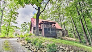 A house with a red roof, a balcony, and a stone foundation. - A-frame Cabin w/ Hot Tub < 1 Mi to Ober Gatlinburg (Gatlinburg)