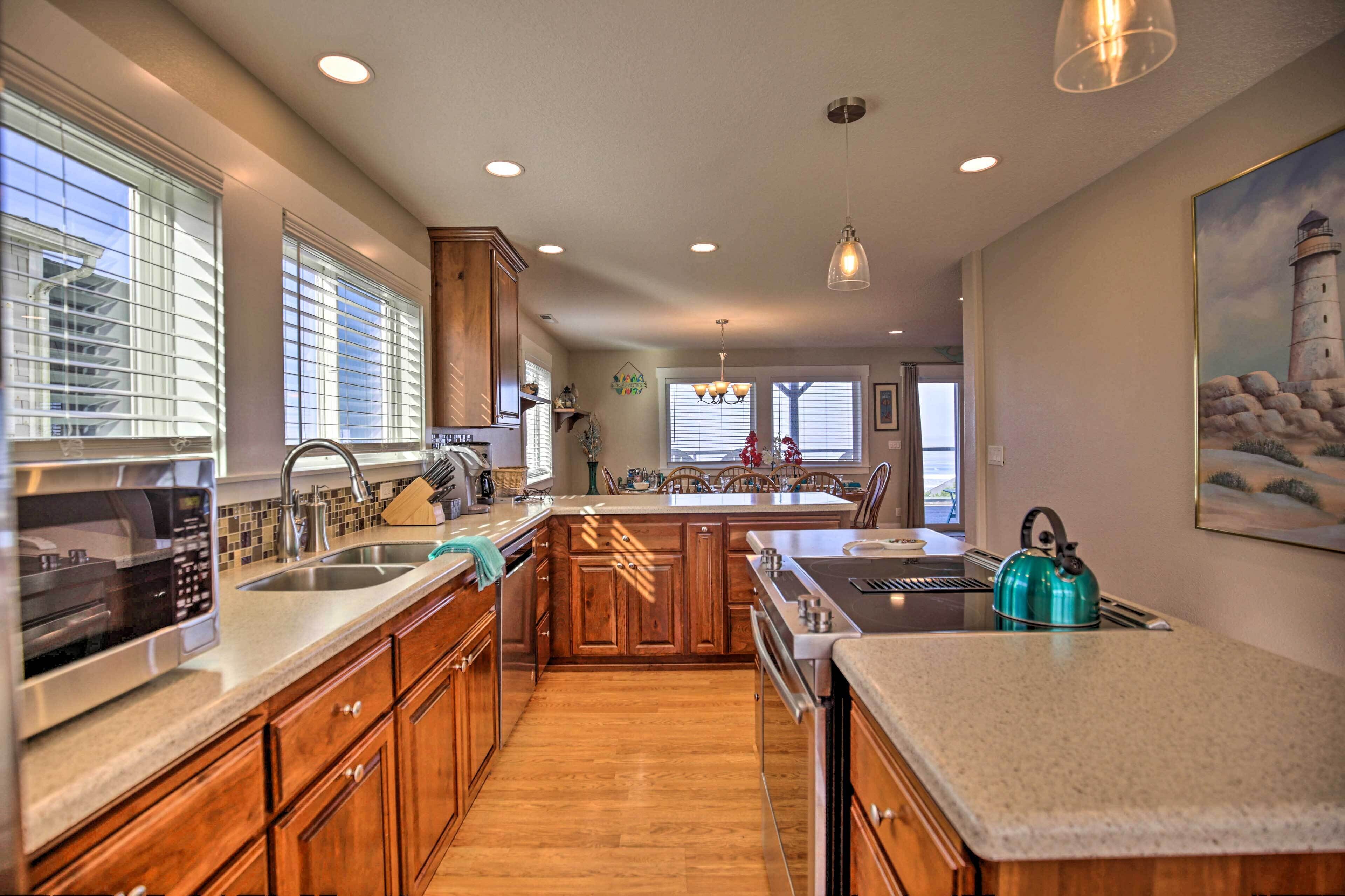 A modern kitchen with wooden cabinets, stainless steel appliances, and a large island.