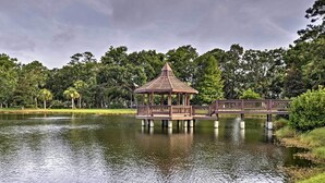 A gazebo on stilts over a body of water, surrounded by lush greenery and trees. - 1 Mi to Beach: Family-friendly Evian Resort Condo! (Hilton Head Island)