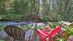 Two chairs by a forest stream. - Creekside Mtn House w/ Deck: 8 Mi to Idaho Springs (Dumont)