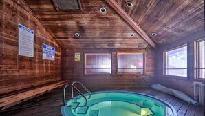 A wooden cabin with a swimming pool, wooden walls, and a ceiling with recessed lighting. - Slopeside Condo With Hot Tub + Game Room Access! (Brian Head)