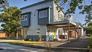 A two-story residential building with a balcony and a covered porch area. - Missoula Getaway w/ Balcony, 2 Mi to Downtown! (Missoula)