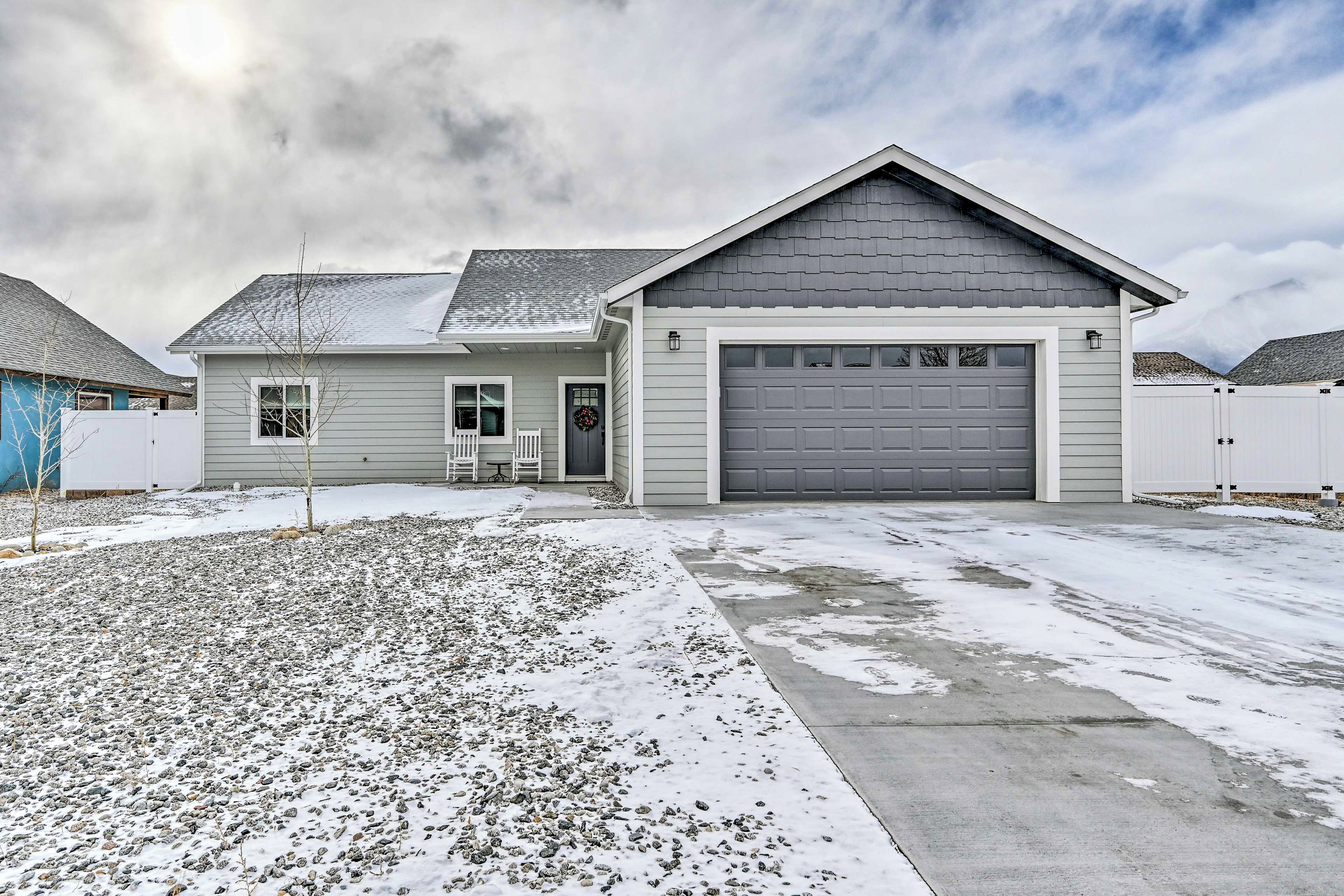 A single-story house with a garage, a front porch, and a driveway.