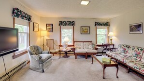 A living room with a television, two sofas, a coffee table, and a chair. - Private Retreat w/ Deck: 1 Mi From Cowanesque Lake (Lawrenceville)