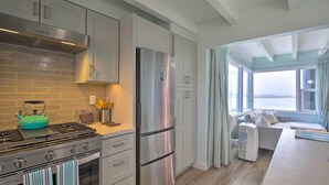 A modern kitchen with stainless steel appliances, a gas stove, and a built-in oven. - Chic Bay View Condo < 10 Miles to Dtwn San Diego! (San Diego)