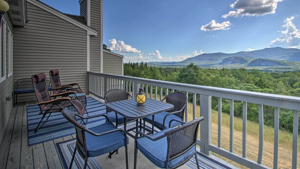 A deck with outdoor furniture and a view of mountains. - Intervale Family Retreat: Mtn View & Pool Access! (Intervale)