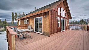 A wooden cabin with a deck, large windows, and a sliding glass door. - 9 Mi to Heavenly Mountain: South Lake Tahoe Home! (South Lake Tahoe)