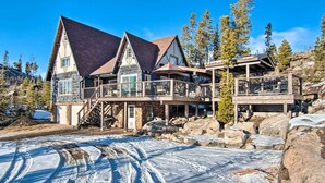 A large, multi-story lodge with a stone facade, wooden balconies, and a ski lift. - Outdoor Kitchen & Swim Spa: 1-acre Grand Lake Home (Grand Lake)