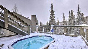 A hot tub surrounded by snow, with a wooden deck and a view of snow-covered trees. - Silverthorne Gem w/ Community Perks: 11 Mi to Ski! (Silverthorne)