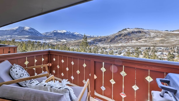 A balcony with a view of snow-capped mountains and a town below. - 7 Mi to Keystone: Mtn-view Abode w/ Deck! (Dillon)
