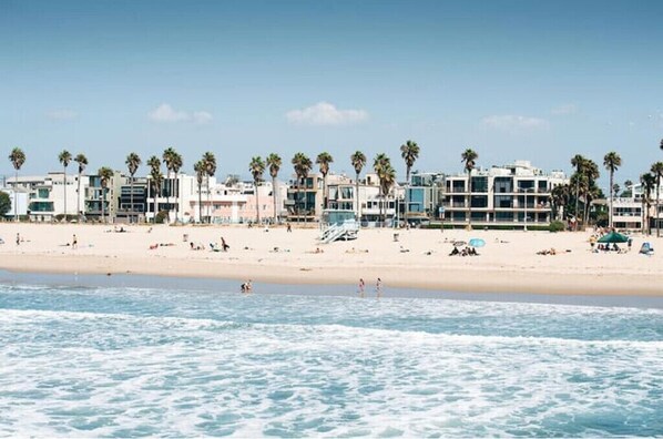 Guests can enjoy stunning ocean views from their beachfront balcony.