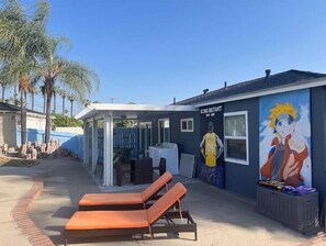 Relax on the covered patio with two comfortable lounge chairs.