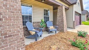 A brick exterior with two Adirondack chairs and a small plant. - Family-friendly Calera Getaway w/ Game Room! (Calera)