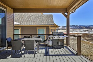 Enjoy al fresco dining on this deck with a barbecue grill and comfortable seating for four.