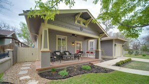 A house with a covered porch, outdoor seating, and a well-maintained garden. - Cocktail Pool! Fredericksburg Bungalow By Main St (Fredericksburg)