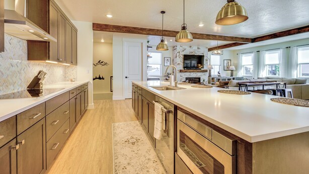 A spacious kitchen with a large island, wooden cabinets, and pendant lighting. - Stunning Home w/ Hot Tub Near Park City Skiing! (Park City)