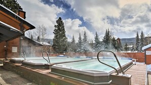 A hot tub area with three hot tubs on a wooden deck, surrounded by snow-covered trees and mountains in the background. - Ski & Relax Fireside: Frisco Gem w/ Resort Perks! (Frisco)