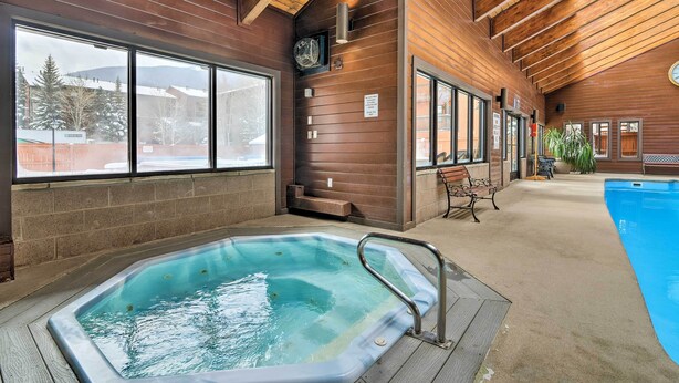 A hot tub area with a wooden interior, large windows, and a pool. - Ski & Relax Fireside: Frisco Gem w/ Resort Perks! (Frisco)