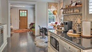 A modern kitchen with a built-in oven, a coffee maker, and a hanging light fixture. - Pool & Hot Tub: Ideally Located 'austin Oasis' (Austin)
