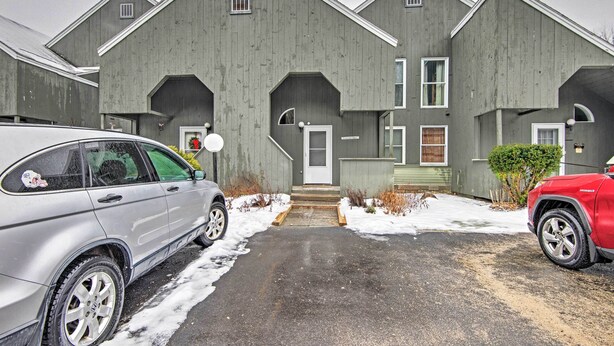A row of grey wooden townhouses with a central entrance and a driveway. - Near Newfound Lake: Plymouth Condo w/ Fireplace! (Plymouth)