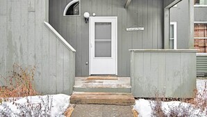 A wooden building with a white door, a small window, and a sign above the door. - Near Newfound Lake: Plymouth Condo w/ Fireplace! (Plymouth)