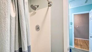 A shower with a handheld showerhead and a control knob. - Near Newfound Lake: Plymouth Condo w/ Fireplace! (Plymouth)