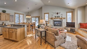 A spacious living area with a fireplace, a television, and a cozy seating arrangement. - 5 Mi to Ski Resort: Breck Home w/ Hot Tub! (Breckenridge)
