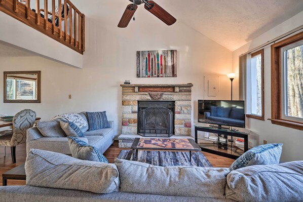 A living room with a fireplace, a television, and a large window. - 4 Mi to Tobyhanna State Park: Home w/ Fire Pit (Tobyhanna)