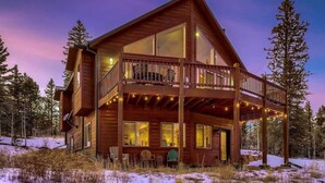 A wooden cabin with a balcony and large windows, surrounded by trees and snow. - Jefferson Cabin w/ Fire Pit: Near Hiking Trails! (Como)