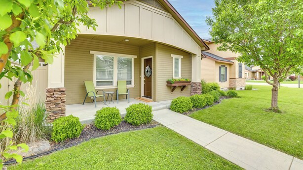 A single-story house with a front porch, a stone accent wall, and a small patio area. - Charming Boise Home ~ 8 Mi to Downtown! (Garden City)