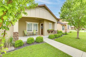 A single-story house with a front porch, a stone accent wall, and a small patio area. - Charming Boise Home ~ 8 Mi to Downtown! (Garden City)