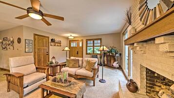 House (3 Bedrooms) | Living area | TV, fireplace, books