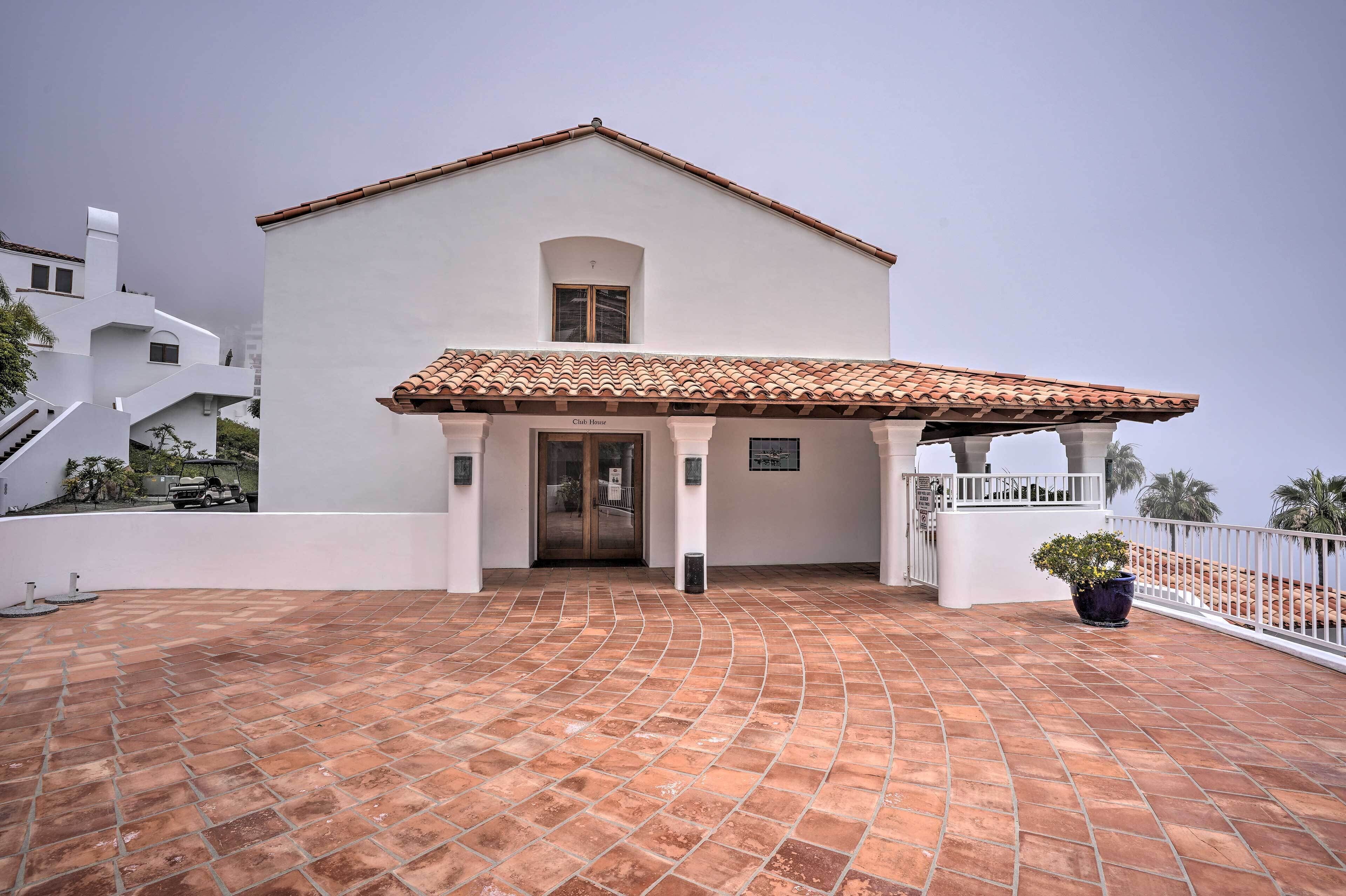 A building with a tiled roof and a covered entrance.