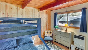 A room with a bunk bed, a desk with drawers, a radiator, and a window with curtains. - 1 Mi to Snow Summit: Big Bear Lake Cabin! (Big Bear Lake)