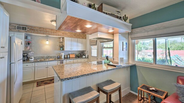 A kitchen with white cabinets, a granite countertop, and a 'No Smoking' sign. - Vintage Las Vegas Oasis < 3 Mi to the Strip! (Las Vegas)