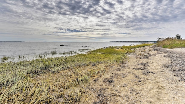 A coastal path with grass and sand, leading to a body of water with boats. - Mattapoisett Home on 7 Acres w/ Private Beach! (Mattapoisett)