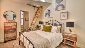 A bedroom with a bed, dresser, nightstand, ladder, artwork, and a skylight. - Walkable Park Mountain Getaway: Hot Tub & Views! (Park City)