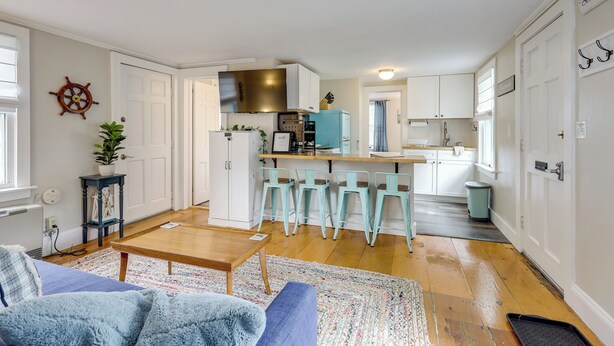 A compact living space with a kitchen, dining area, and seating area. - 1 Mi to Ferry: 'sea Street Cottage' in Hyannis (Hyannis)