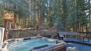 A hot tub on a wooden deck surrounded by a forest. - 6 Mi to Breck Resort: Family Cabin w/ Game Room (Breckenridge)