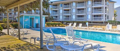 A pool area with lounge chairs and a small building labeled "First Floor Restrooms."