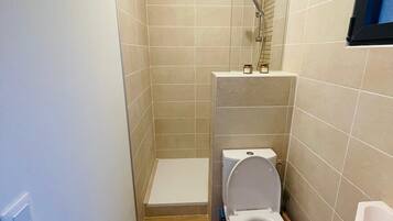 Shower, towels, soap, toilet paper