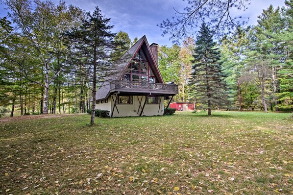 A cabin with a steeply pitched roof, large windows, and a balcony. - Ski Chalet on Saco < 2 Mi To Attitash Resort! (Bartlett)