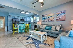 Enjoy a bright kitchen with a central island and cozy seating area, featuring a large window with an outdoor view.
