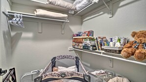 A nursery with a changing table, shelves with baby products, and a teddy bear. - 3 Mi to Rmnp! Mtn-view Retreat in Estes Park (Estes Park)