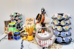A coffee bar setup with various coffee pods, tea bags, and utensils. - 4BR Philly Townhome -minutes to Stadiums & Upenn (Philadelphia)