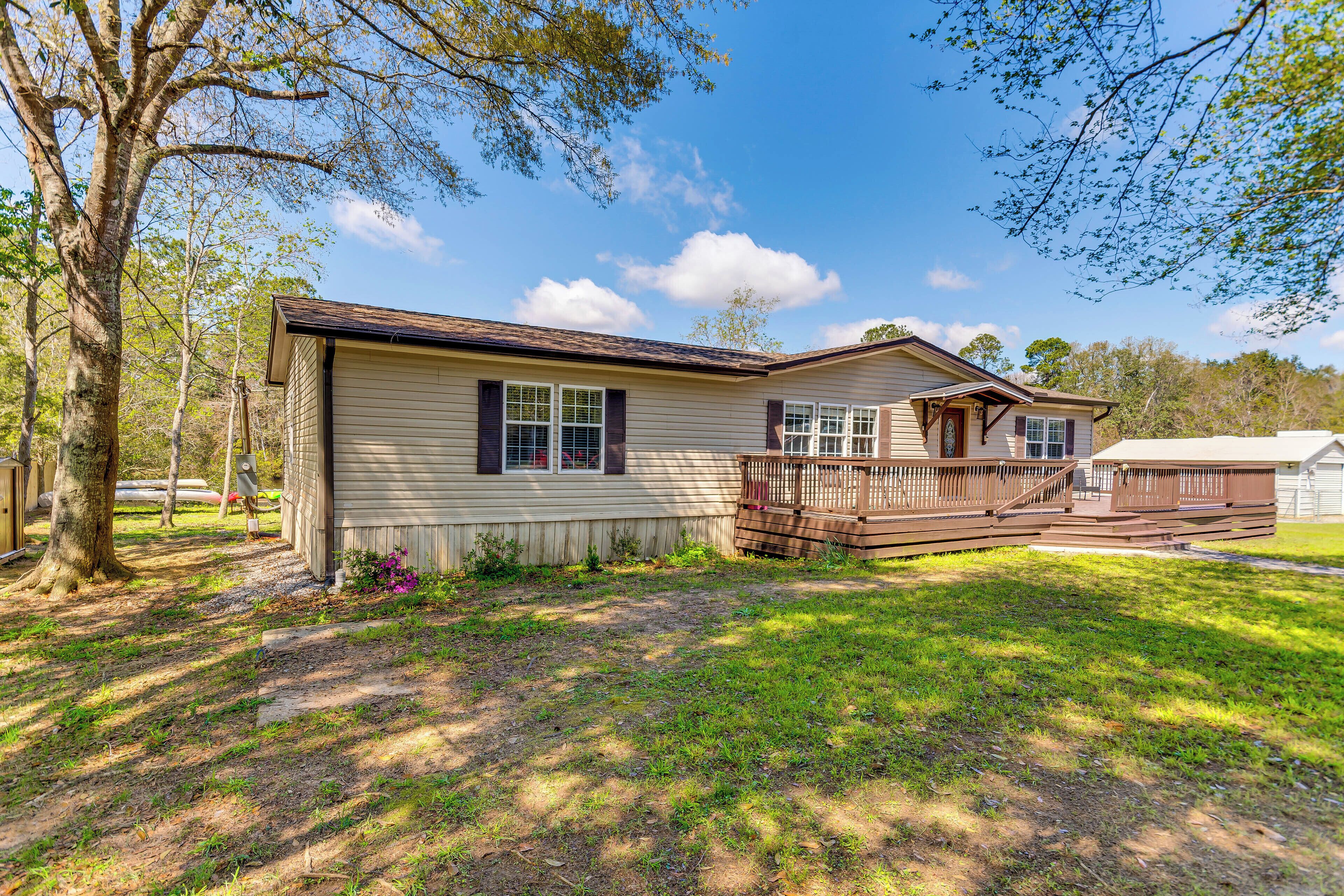 A single-story house with a front deck and a small porch.
